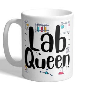 May include: White ceramic mug with a black design that says "Lab Queen" and features various science-related illustrations, including beakers, test tubes, and atoms.