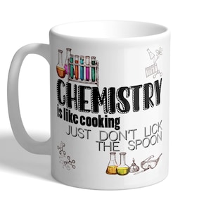 May include: White ceramic mug featuring a black and white graphic that reads "Chemistry is like cooking just don't lick the spoon". The graphic also includes colourful beakers and test tubes.
