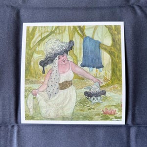 May include: Watercolour print depicting a woman in a white dress and a large mushroom hat, in a swamp setting. A smaller mushroom creature is in the water. A blue garment hangs on a tree branch in the background.