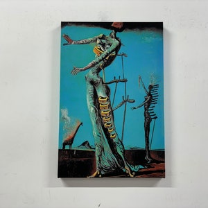 May include: Surrealist painting featuring a tall, slender figure with a long, flowing blue dress and a series of drawers on its back. The figure is standing on a platform with a giraffe in the background. The painting is set against a blue sky.