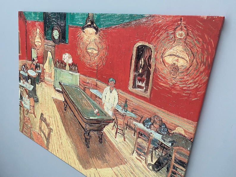 May include: A painting of a barroom interior with a pool table in the foreground. The walls are a deep red, and there are several people sitting at tables. The painting is in a style reminiscent of Vincent van Gogh.