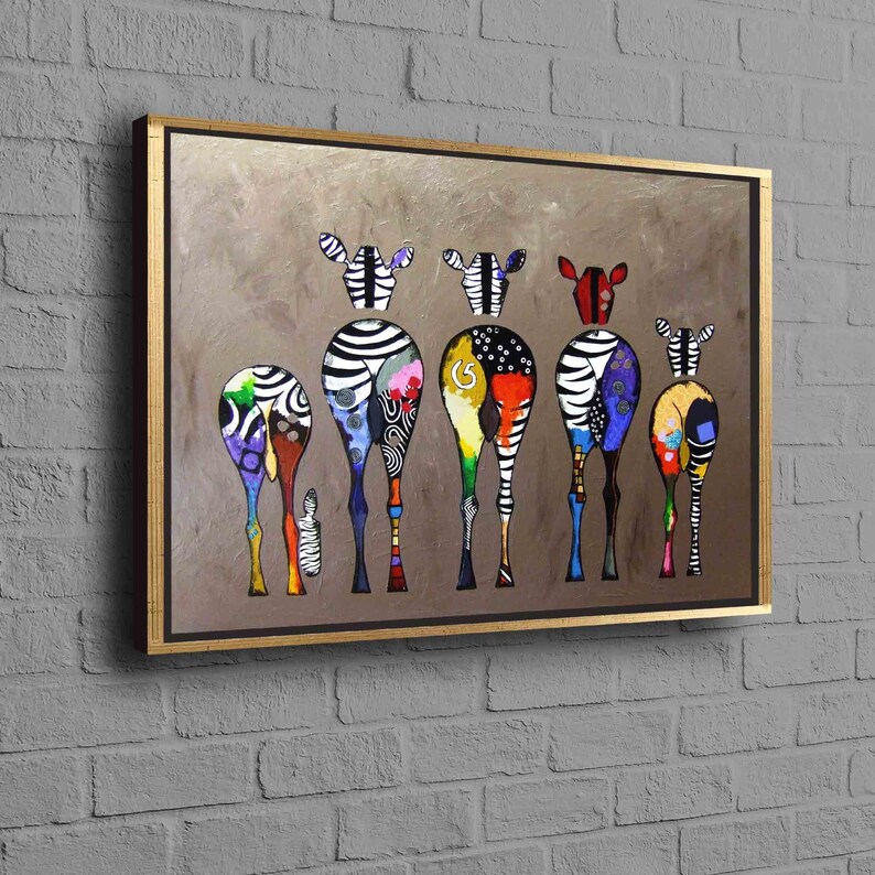 May include: A colorful painting of a group of zebras standing in a line. The zebras are all different colors and have black and white stripes. The background is a light brown color.