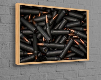 May include: A close-up image of a pile of black and copper-colored bullets.