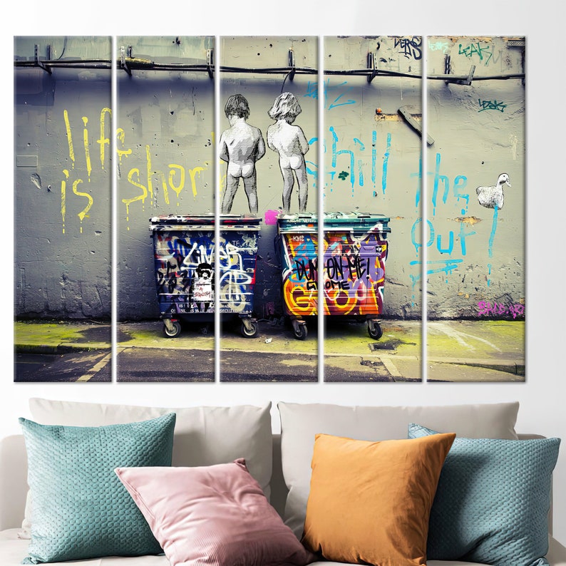 May include: A multi-panel wall art print featuring a graffiti-covered wall with the words "Life is short, chill the f*** out!" in yellow, blue, and pink paint. Two figures are depicted in the center of the wall, with their backs to the viewer, and a duck is painted on the right side of the wall. Three colorful trash cans are in the foreground.
