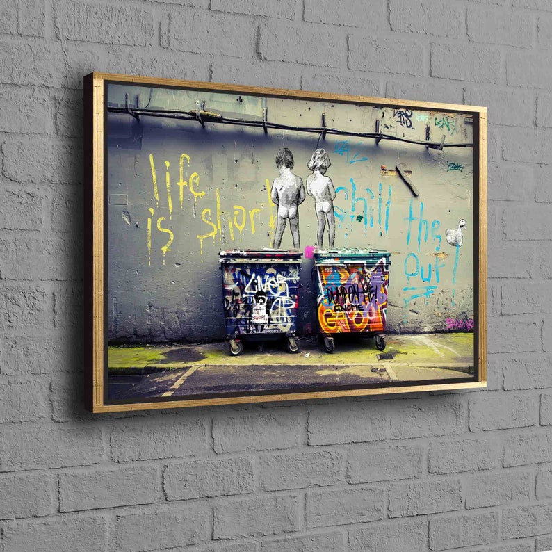 May include: A graffiti art print featuring two figures standing in front of two graffiti-covered trash cans. The wall behind them has the words "Life is short, chill the f*** out" written in yellow and blue paint.