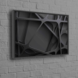 May include: Black and white abstract wall art with a geometric design. The art is framed in a black frame.