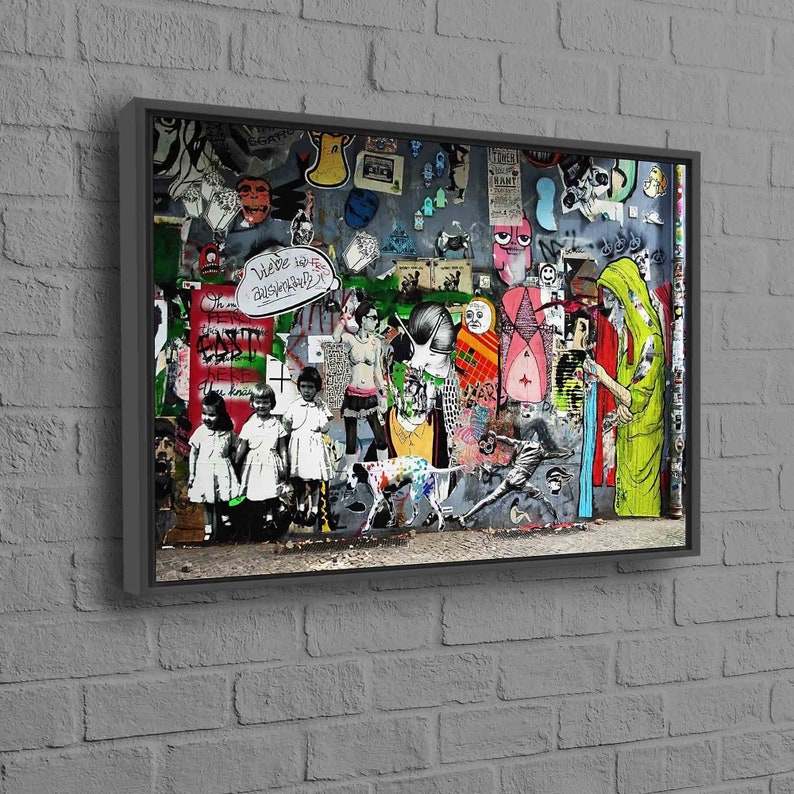 May include: A colorful street art mural with a variety of images and text, including a dog, a person in a yellow robe, and the words "We're in the dishwasher".