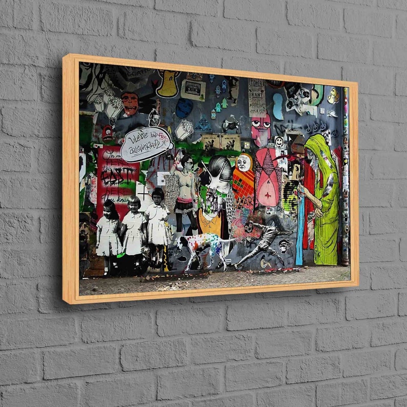 May include: A framed collage of colorful street art featuring a dog, people, and various symbols. The art is on a wall with a brick texture. The text "We've got to be cautiously optimistic" is visible in the image.
