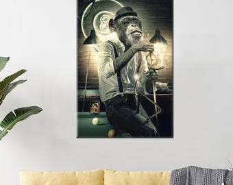 May include: A framed print depicts a chimpanzee in a white shirt, suspenders, and a hat, holding a pool cue and a drink. The background features a pool table, a neon eight ball, and a brick wall, creating a vintage bar scene.