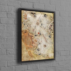 May include: A vintage nautical map printed on canvas and framed in black. The map features a compass rose, ships, and handwritten text.