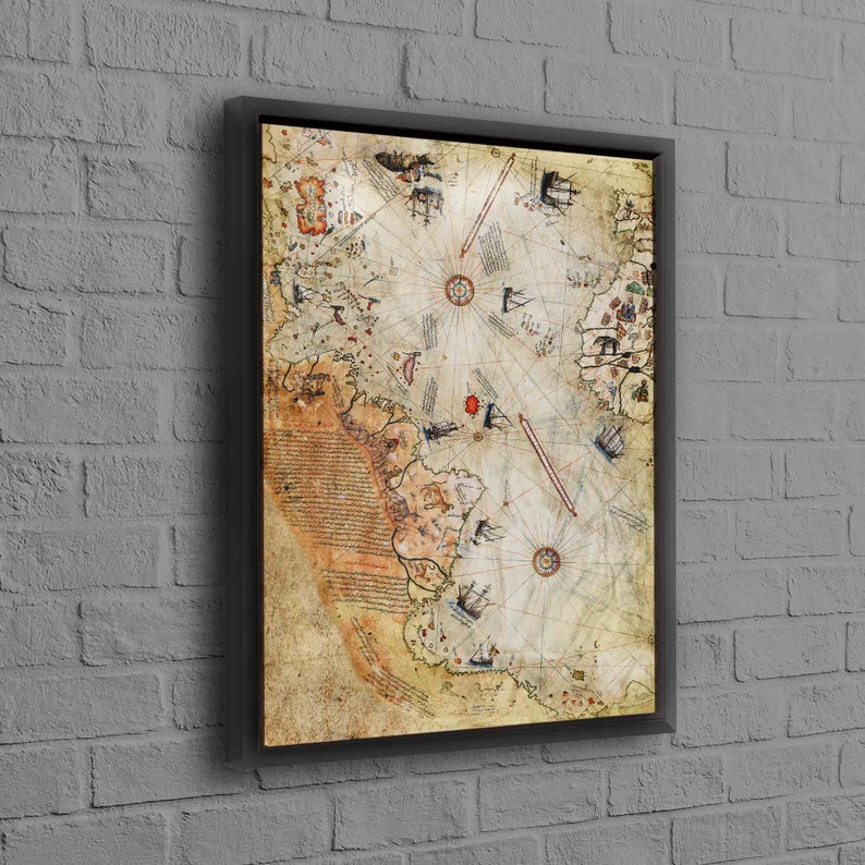 May include: A vintage nautical map printed on canvas and framed in black. The map features a compass rose, ships, and handwritten text.