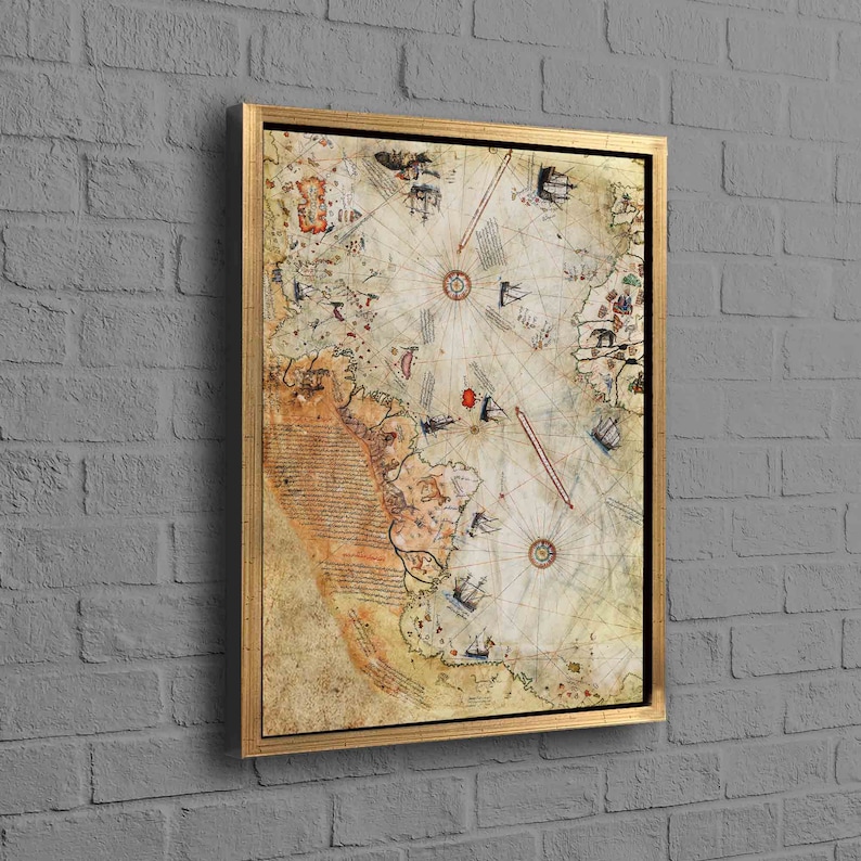 May include: A vintage-style map print in a gold frame. The map is a detailed depiction of a coastline with ships and islands. The map is in shades of brown, beige, and white.