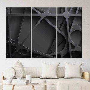 May include: Abstract art print featuring a black and white geometric design with overlapping lines and shapes. The print is divided into three panels.