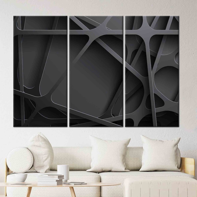 May include: Abstract art print featuring a black and white geometric design with overlapping lines and shapes. The print is divided into three panels.