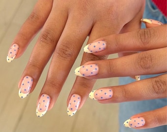 Press on nails butter yellow French tips with blue polka dot design almond nails, glue on extra strong false nails