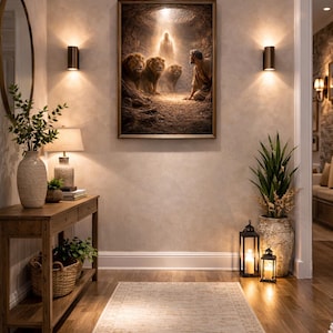 May include: An interior hallway with a framed picture of a biblical scene with lions and a man. The space includes a wooden console table with a lamp, a rug, and decorative plants. Two wall lights provide warm lighting.
