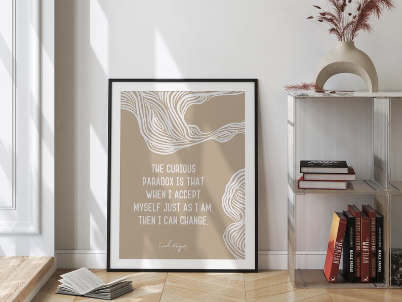 May include: A beige and white printable wall art print with a quote by Carl Rogers: "The curious paradox is that when I accept myself just as I am, then I can change."