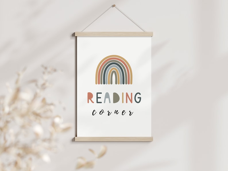 May include: A white canvas print featuring a colourful rainbow and the text "READING corner" in a playful font.