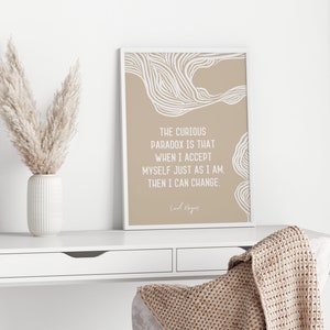 May include: A beige and white printable wall art print with a quote by Carl Rogers: "The curious paradox is that when I accept myself just as I am, then I can change."