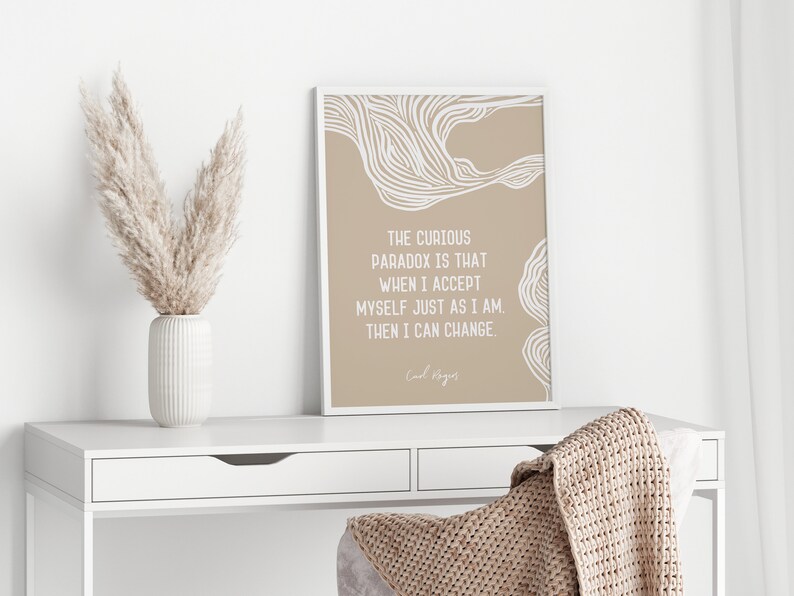 May include: A beige and white printable wall art print with a quote by Carl Rogers: "The curious paradox is that when I accept myself just as I am, then I can change."