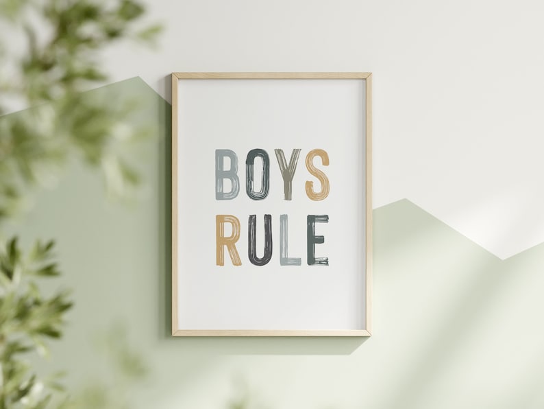 May include: A framed print with the text "BOYS RULE" in colorful, brushstroke-style lettering. The letters are in shades of blue, green, and yellow.