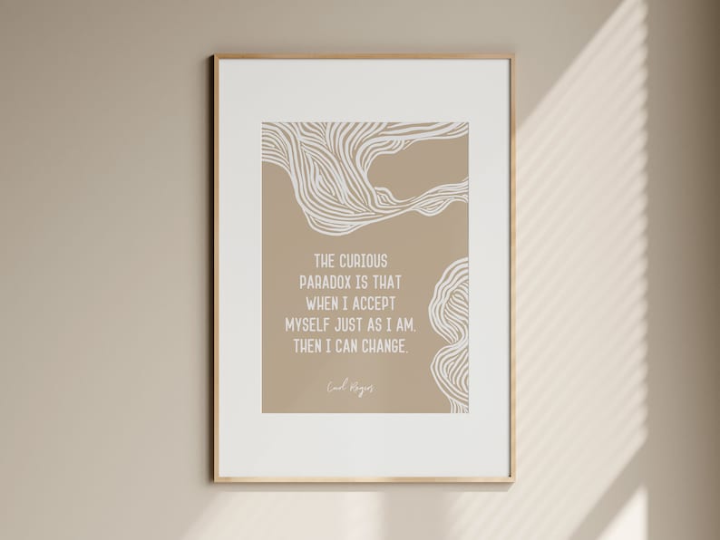 May include: A beige printable wall art print with a white abstract design and a quote that reads "The curious paradox is that when I accept myself just as I am, then I can change." The quote is attributed to Carl Rogers.