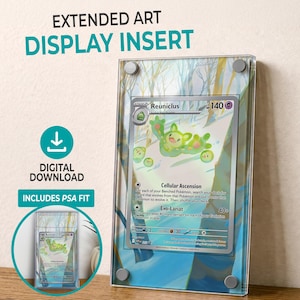 May include: A clear acrylic display insert for a trading card, featuring a Reuniclus card with green and yellow artwork. The display includes the text "EXTENDED ART DISPLAY INSERT" and "DIGITAL DOWNLOAD".
