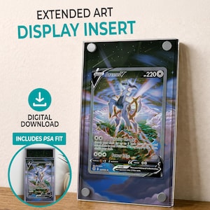 May include: A clear acrylic display insert for a trading card, with the text "EXTENDED ART DISPLAY INSERT" and "DIGITAL DOWNLOAD INCLUDES PSA FIT". The insert holds a card with an Arceus V illustration, with a blue and white background.