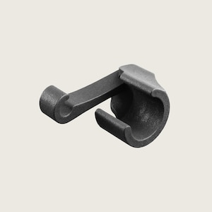 May include: Black plastic hook with a curved design. The hook is designed to be attached to a surface and has a small loop at the end for hanging items.