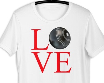 May include: White t-shirt with the word "LOVE" in red letters and a black and white bowling ball in the center of the word.