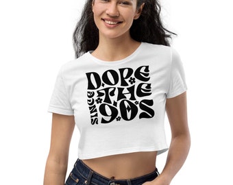 May include: White cropped t-shirt with a black graphic that says "Dope Since The 90s" in a retro font.