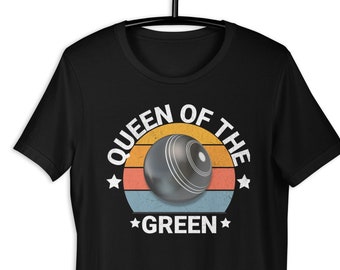 May include: Black t-shirt with a white graphic of a bowling ball and the text "Queen of the Green" in a retro sunset design.