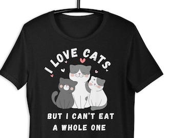 May include: Black t-shirt with a white graphic of three cartoon cats and the text "I love cats but I can't eat a whole one."