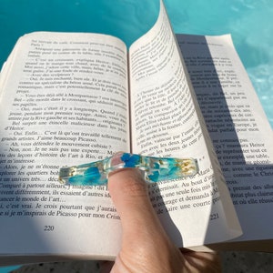Handmade resin reading ring with natural blue flowers and gold leaves for a reader or a unique and useful gift for a reader