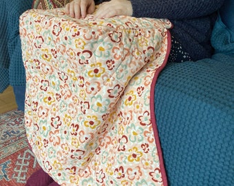 Floral peach pink cosy quilted lap blanket, made of needlecord, handmade by the Dreaming Dormouse