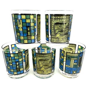 May include: A set of five vintage drinking glasses. Each glass has a unique design with blue, green, and yellow geometric patterns and circuit board-style graphics. The glasses are clear with a white rim.