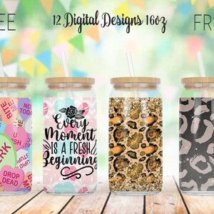 May include: Four glass tumblers with bamboo lids and straws. Designs include conversation hearts, floral, leopard print, and a gray leopard print. Text on the tumblers reads "FREE 12 Digital Designs 16oz FREE" and "Every Moment Is A Fresh Beginning."
