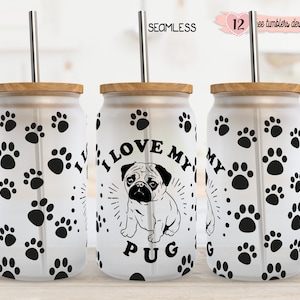 May include: Three white tumblers with black paw prints and a black and white pug illustration. The tumblers have a wooden lid and a stainless steel straw. The text on the tumbler reads "I love my pug".