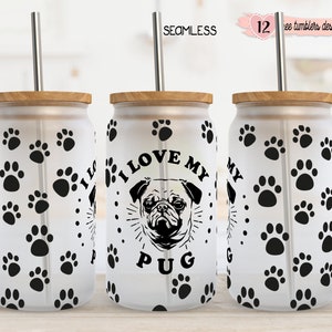 May include: Three white tumblers with black paw print designs and a black and white pug illustration with the text "I Love My Pug". The tumblers have wooden lids and stainless steel straws.
