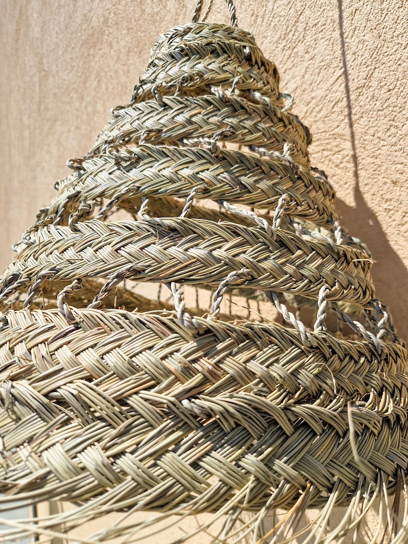 Suspension ajourée en feuille de palmier