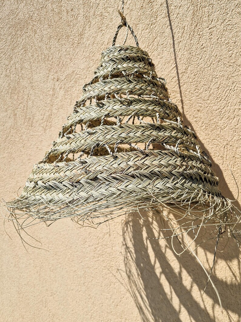 Suspension ajourée en feuille de palmier