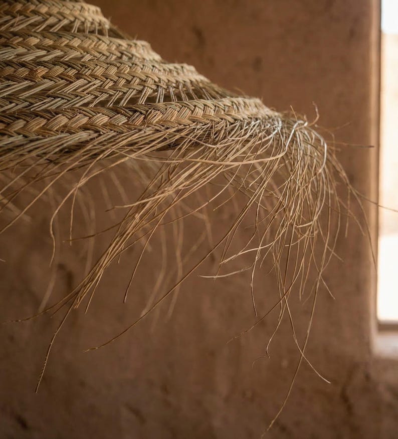 Suspension parasol ajourée en feuille de palmier