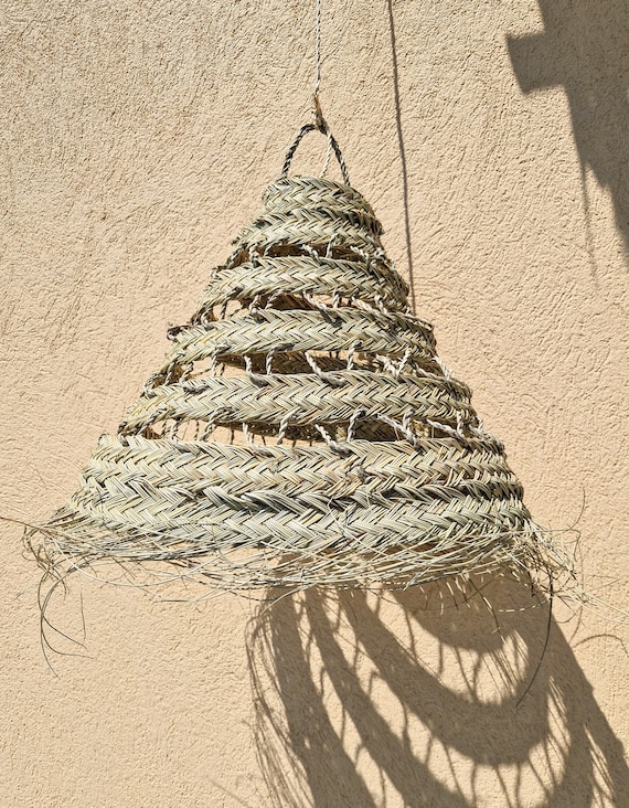 Suspension ajourée en feuille de palmier