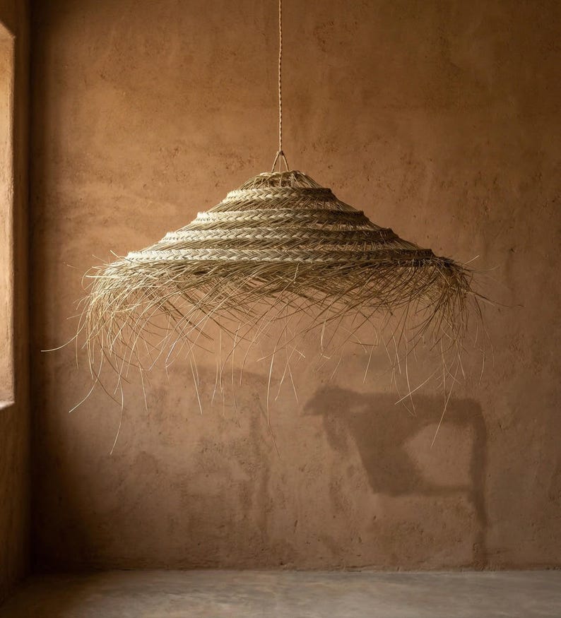 Suspension parasol ajourée en feuille de palmier