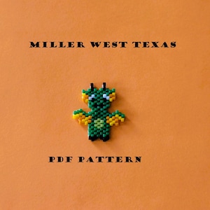 May include: A green and yellow beaded dragon with black eyes and wings. The text "MILLER WEST TEXAS" and "PDF PATTERN" is below the dragon.