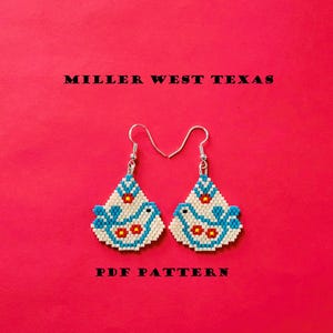 May include: A pair of beaded earrings with a bird design in white, blue, and red. The earrings are on a red background with the text "MILLER WEST TEXAS" and "PDF PATTERN". The earrings have silver-colored hooks.
