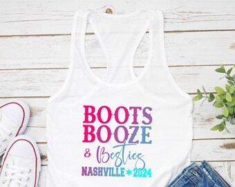 May include: White tank top with the text "BOOTS BOOZE & Besties NASHVILLE * 2024" in a rainbow gradient. The text is in a casual, handwritten font.