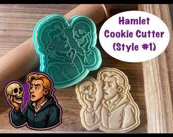 May include: Three Hamlet cookie cutters in different styles. One is a teal plastic cutter, another is a tan cookie, and the third is a cartoon illustration. The text "Hamlet Cookie Cutter (Style #1)" is in a purple oval.