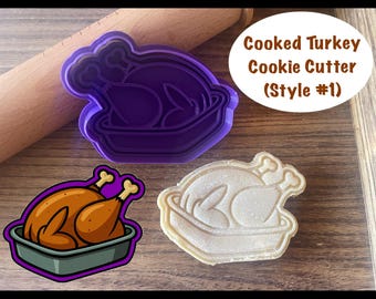 May include: A purple plastic cookie cutter in the shape of a cooked turkey in a roasting pan. The image also shows a baked cookie and a cartoon illustration of a cooked turkey. Text on the image reads "Cooked Turkey Cookie Cutter (Style #1)".