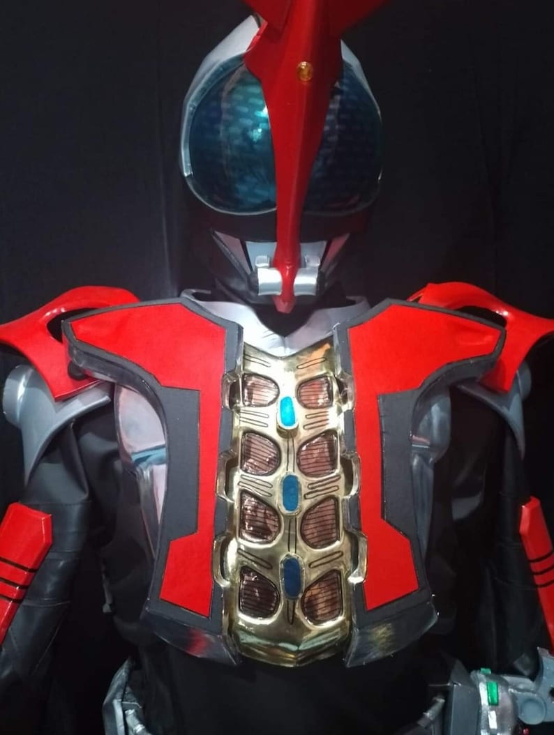 May include: A red and black superhero costume with a gold chest piece and a red and white helmet with a blue visor.